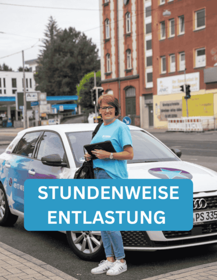 Olga (Pflegefachkraft) steht vor dem Pflegedienst Stern Auto in Kassel