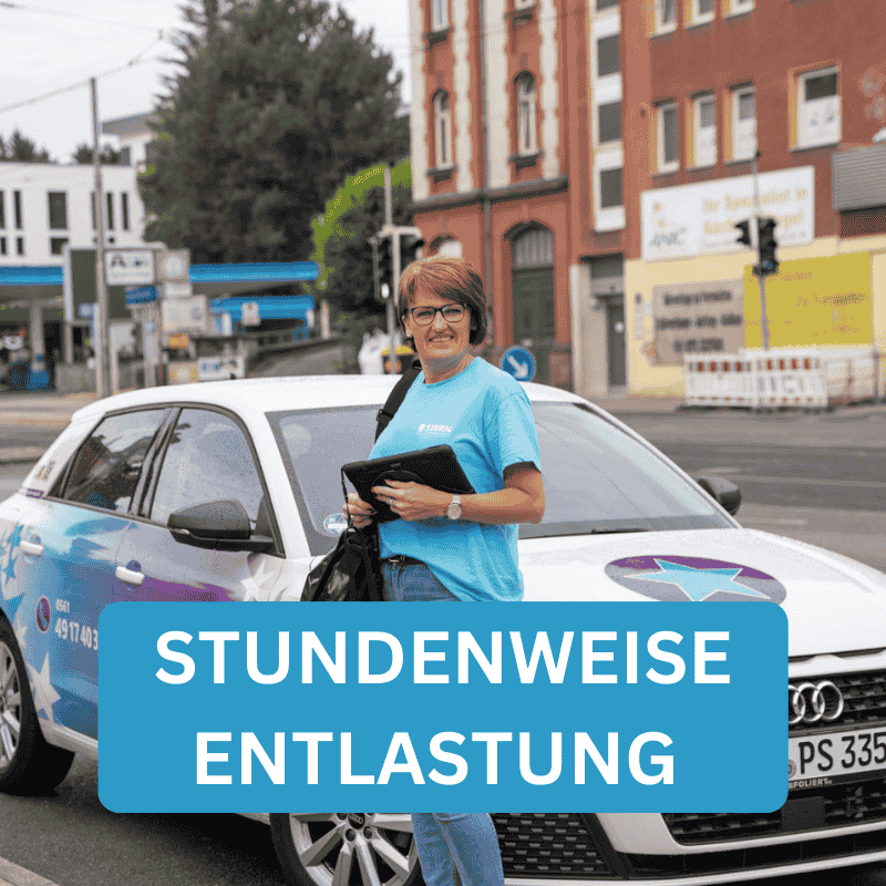 Olga (Pflegefachkraft) steht vor dem Pflegedienst Stern Auto in Kassel